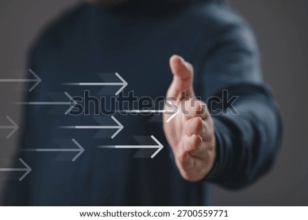 Hand reaching forward with moving arrow graphics, symbolizing business growth, progress, innovation, leadership, and forward direction toward success and development.