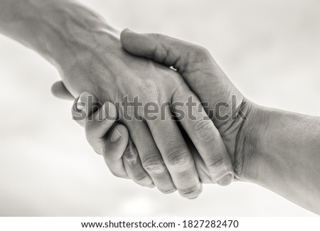 Hand reaching to help someone in need. 