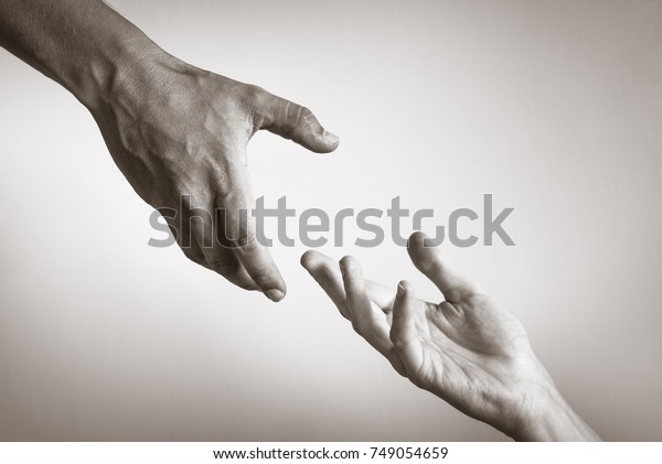 Hand reaching out to\
help