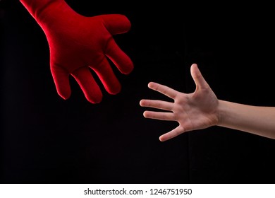 Hand Reaching Out For Help, Boy Playing With Red Plush Soft Toy. Child Getting Help From Imaginary Friend