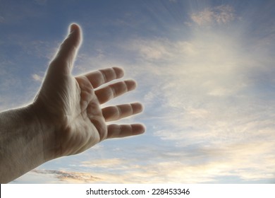 Hand Reaching For The Sky