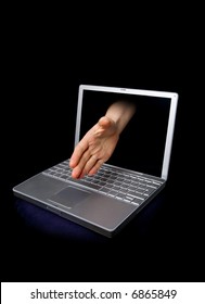 A Hand Reaching Through The Computer Screen In A Hand Shaking Gesture