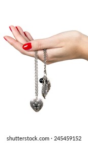 A Hand With Red Nail Holding A Heart Shaped Necklace 
