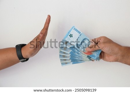 Hand refusing and don't receive bribe money. Concept of anti bribery and anti corruption