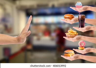 Hand refusing junk food with white background - Shutterstock ID 406013992
