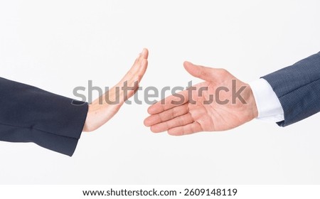 Hand refusing to shake hands