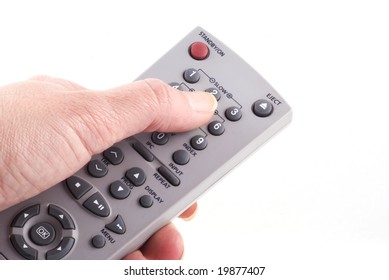 Hand with remote control isolated on white.