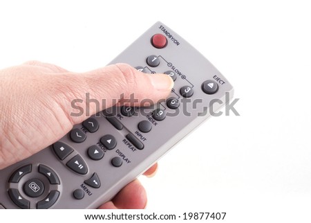 Hand with remote control isolated on white.