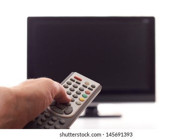 Hand With Remote Control Over The TV Set Off