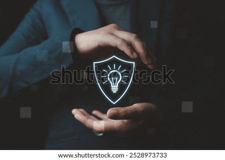 A businessman’s hand reveals a virtual screen displaying the protection of intellectual property rights, emphasizing exclusive copyright and innovation protection to safeguard creative ideas