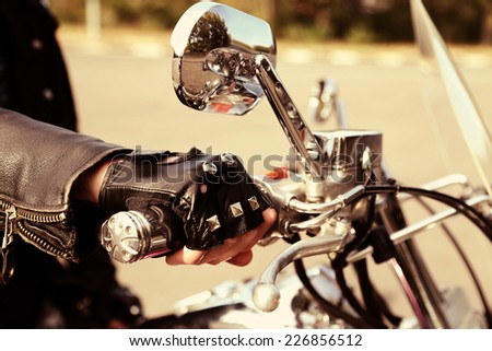 Similar – Senior man steering motorcycle on road