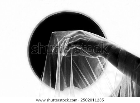 Similar – Long exposure of a woman’s hand at night. Waving hand that wants to say, what a pity that you stop here