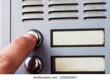 Hand Ringing On Doorbell. Macro Phot