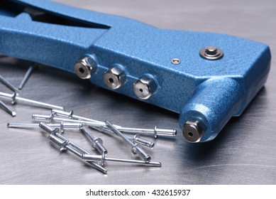 Hand Rivet Tool On Metal Surface