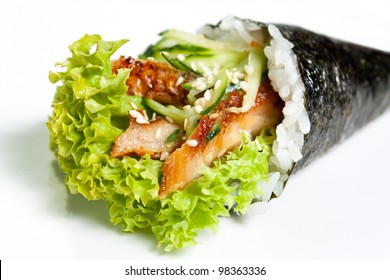 Hand Roll Sushi with eel, lettuce, avocado, cucumber and nori close-up