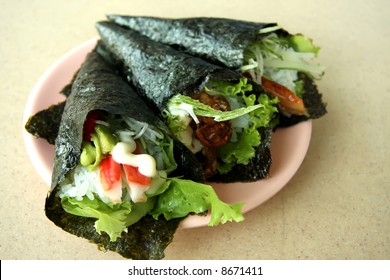Hand rolled temaki sushi traditional japanese cuisine
