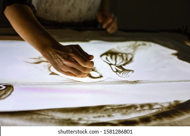 Hand Sand Drawing On The Light Table 