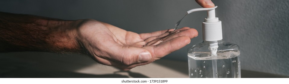 Hand sanitizer dispenser bottle man using antibacterial gel to clean disinfect hands for coronavirus prevention COVID-19 in public transport. Panoramic banner background. - Powered by Shutterstock