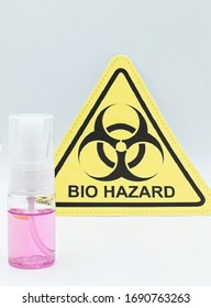 Hand Sanitizer In Plastic Bottle With Bio Hazzard Symbol On The Background. Clean Your Hands Concept