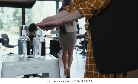 Hand Sanitizer Station At Office Workplace. Close-up Diverse Business People Disinfect Hands Coming To Work Slow Motion.