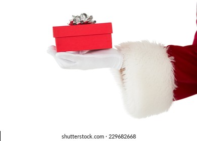 Hand Of Santa Claus Holding A Gift On White Background