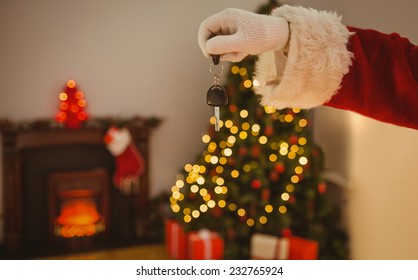 Hand Of Santa Holding Car Key At Home In The Living Room