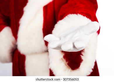 Hand Of Santa Reaching Out. Focus On Hand