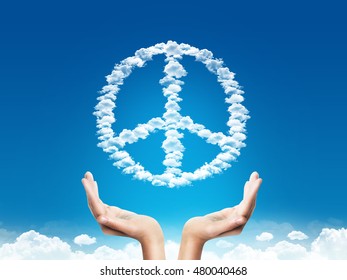 Hand save or protection peace sign shaped clouds over blue background. protection  concept. peace concept.
 - Powered by Shutterstock