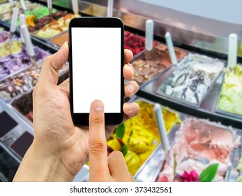 hand is searching the best ice cream shop with the smarphone and the ice creams on the background  - Powered by Shutterstock