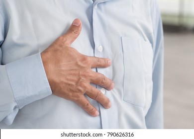 Hand Of Senior Old Man Holding Acid Reflux, Esophagus Cancer Chest