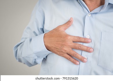 Hand Of Senior Old Man Holding Acid Reflux, Esophagus Cancer Chest