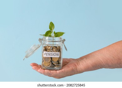 Hand Of Senior Woman With Savings And Young Plant In Jar On Color Background. Concept Of Pension