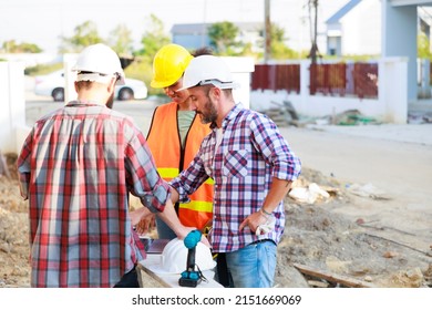 Hand shake. Professional Mechanical Engineer and construction team at house project underconstruction site. Hands meeting together in line. Unity and teamwork concept.