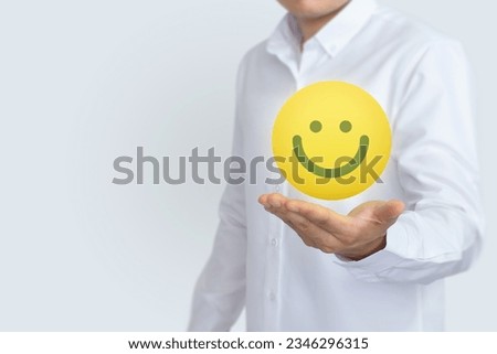 Hand show smile emoticon for rating. Service rating, feedback, satisfaction concept