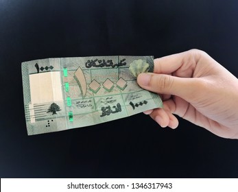 Hand Showing 1000 Lebanese Or Lebanon Money With Black Background/selective Focus   