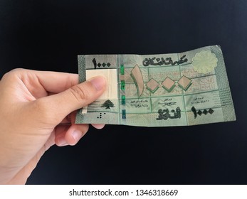 Hand Showing 1000 Lebanese Or Lebanon Money With Black Background/selective Focus   