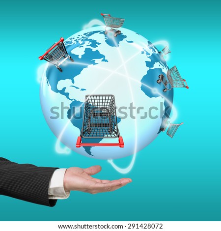 Hand showing 3D globe with world map of shopping carts worldwide, global shopping concept.