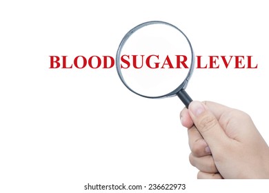 Hand Showing BLOOD SUGAR LEVEL Word Through Magnifying Glass 