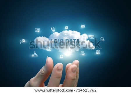 Hand showing a cloud with the words big data on blue background.