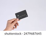 Hand showing credit card, or card, or business card or voucher, isolated on white background, template, mock-up