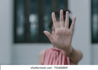 hand showing stop gesture and Violence , stop violence against Women, international women's day.