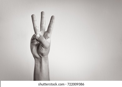 Hand Showing Three Fingers.