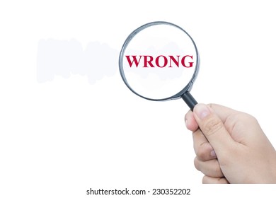 Hand Showing WRONG Word Through Magnifying Glass 