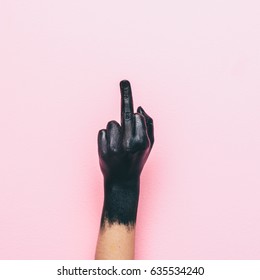 Hand Shows Aggressive Gesture With The Middle Finger. Fuck You Concept. Minimal Style.