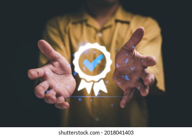 Hand shows the sign of the top service Quality assurance, Guarantee, Standards, ISO certification and standardization concept. - Shutterstock ID 2018041403