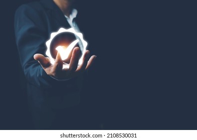 Hand shows the sign of the top service Quality assurance, ISO certification and standardization concept, Standard quality control certification assurance guarantee, Concept. Guarantee, Standards - Shutterstock ID 2108530031