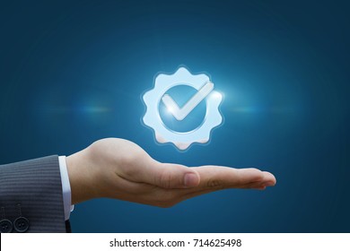Hand shows the sign of the top service on the blue background . - Shutterstock ID 714625498