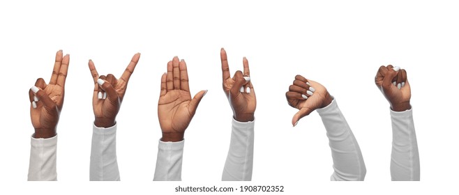 hand sign and people concept - hands of african american women showing various gestures on white background