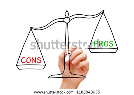 Hand sketching more Cons than Pros scale concept with marker on transparent glass board isolated on white.