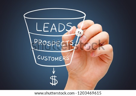 Hand sketching sales or revenue funnel marketing concept with white marker on transparent wipe board.